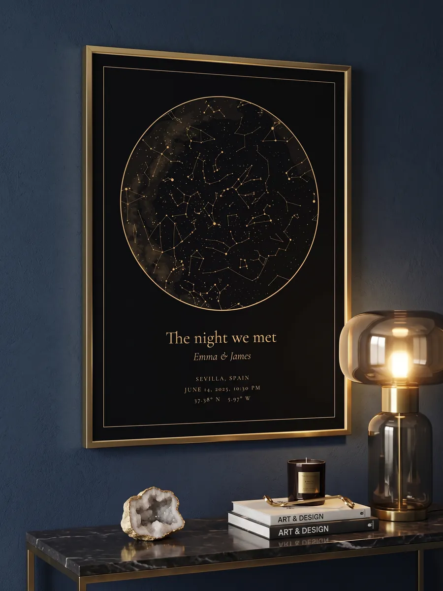 Gold-on-black star map in a gold frame on a navy wall